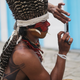 An indigenous tribe member takes a photo of another tribe member on a phone following a protest march for indigenous territorial rights on November 11, 2015 in Angra dos Reis, Brazil.